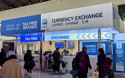 Foto Exact Change (T3 Llegadas - Cinta recogida de equipajes)